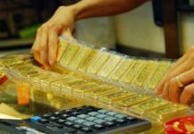 Vàng thế giới tăng sau khi Fed phát tín hiệu ngừng nâng lãi suất